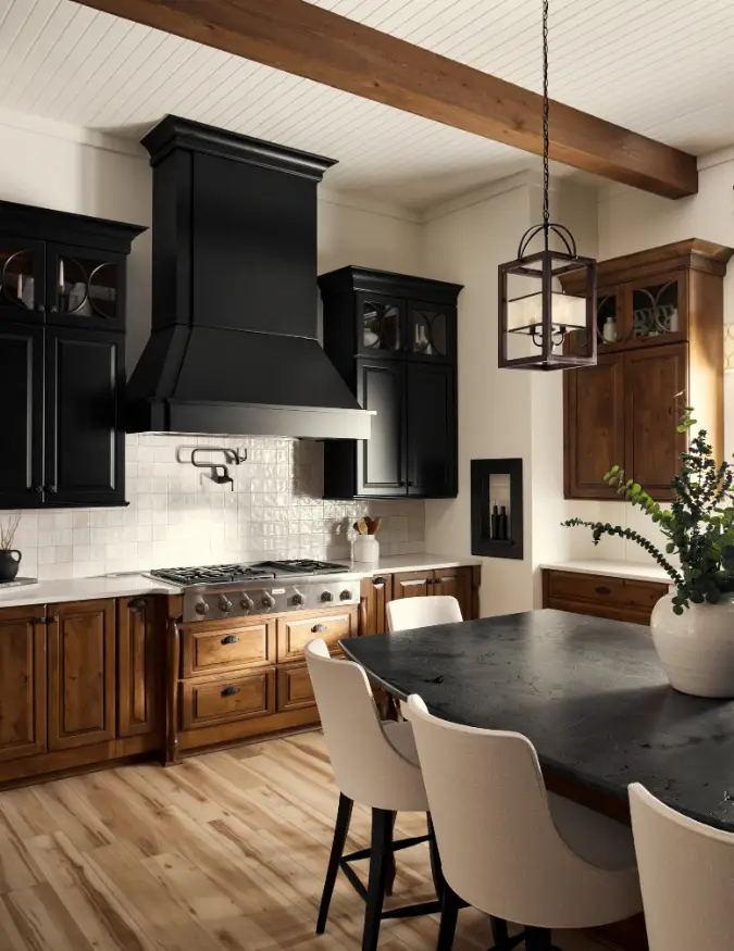 Heritage Grove kitchen with black range hood, wood cabinetry, island seating, and warm interior finishes